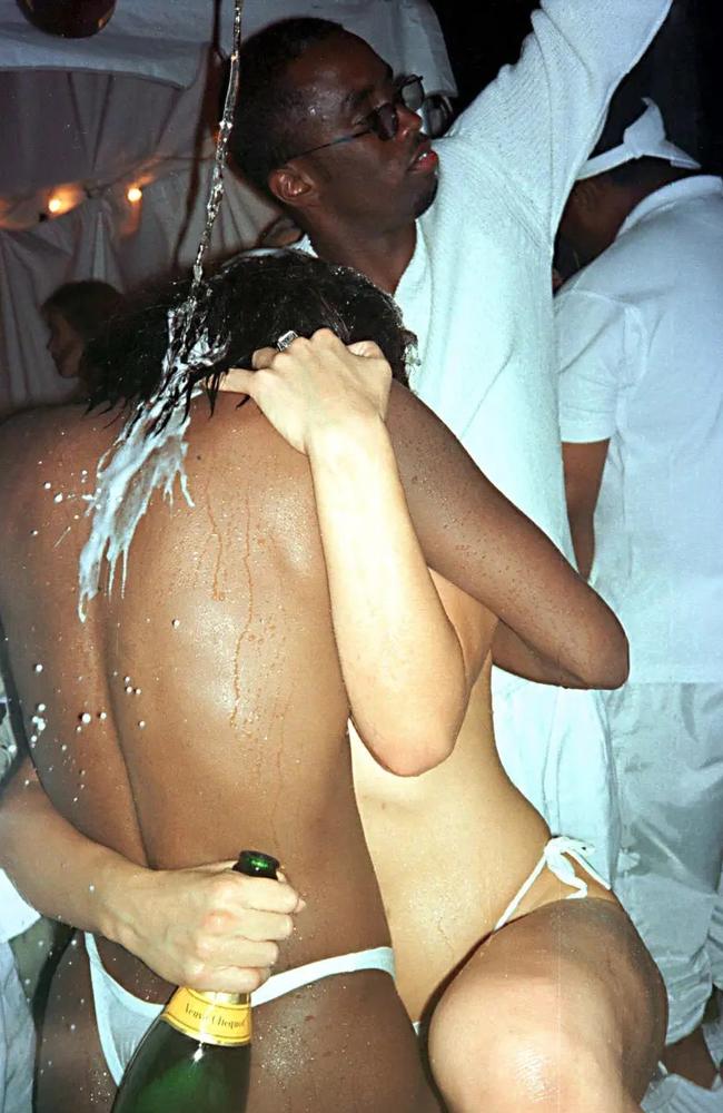 Diddy pouring champagne over two unidentified near-naked women at one of his early White Parties in 1998. Sources tell The Post he would also hold more debauched Freak Offs at the same home. Picture: Globe Photos via ZUMA Wire