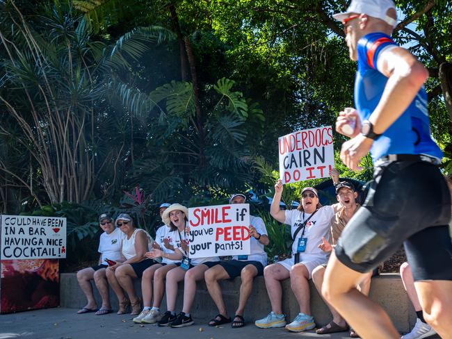 Ironman 70.3 Mens 55-59 age group winner Rob Hamilton of NewZealand Cheers on an athlete with his family during The Cairns Airport IRONMAN Cairns. Picture Emily Barker.