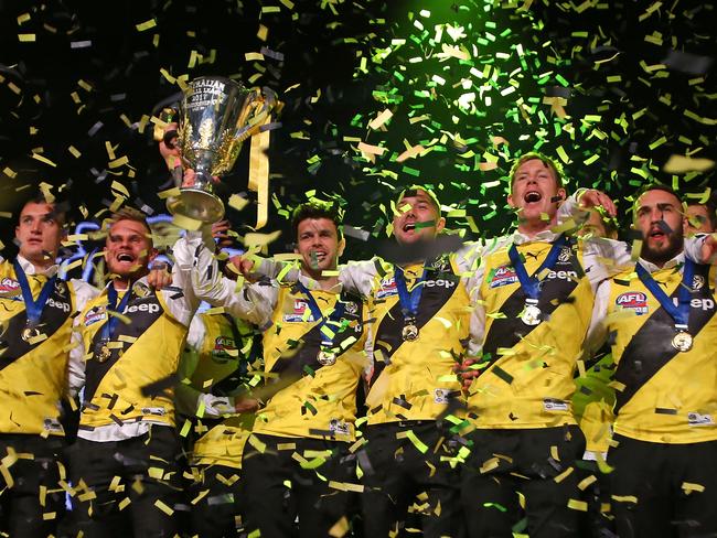 The Tigers celebrate with the AFL premiership cup. Picture: Scott Barbour/Getty Images