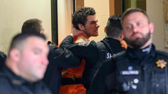 Mangione is led into the Blair County Courthouse for an extradition hearing. Picture: AFP