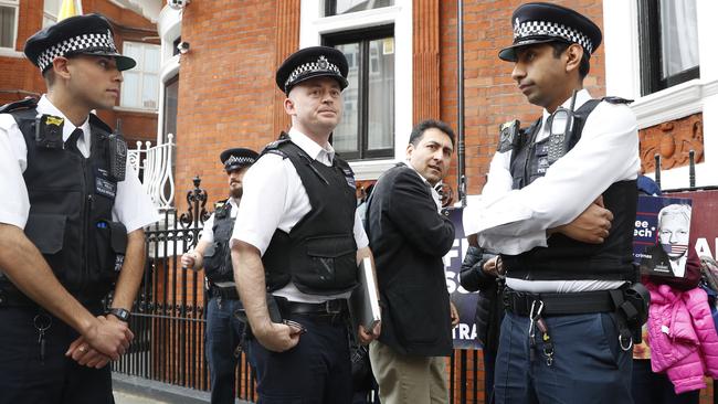 British police arrive and guard the Ecuadorean Embassy as protesters in support Assange demonstrate outside the embassy in London on May 20, 2019. Picture: AFP