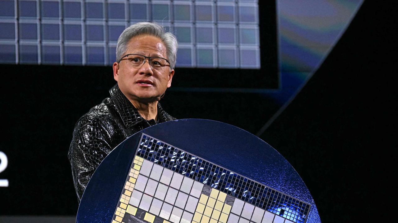 Nvidia CEO Jensen Huang holds a Grace Blackwell NVLink72 as he delivers a keynote address at the Consumer Electronics Show (CES) in Las Vegas. Picture: AFP