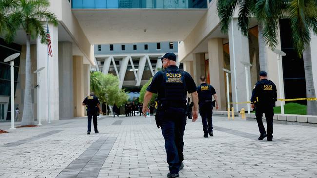 Department of Homeland Security police walk around the Wilkie D. Ferguson Jr. United States Federal Courthouse before the arraignment of Mr Trump. Picture: Getty Images