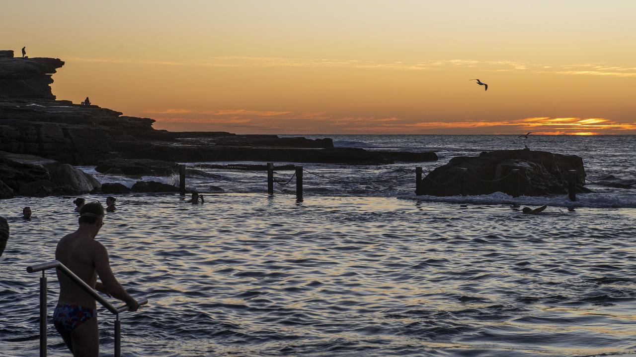 Early morning beachgoers enjoy the sunrise at Mahon Pool in Maroubra. Photo Jeremy Piper