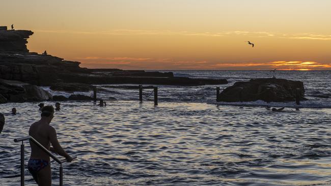 Early morning beachgoers enjoy the sunrise at Mahon Pool in Maroubra. Photo Jeremy Piper
