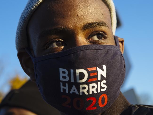 Jerome Barnes, 13, stands among other supporters near where former President Barack Obama was holding a rally. Picture: News Corp Australia