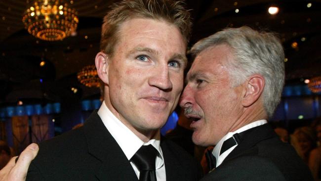 Buckley is congratulated by then coach Mick Malthouse.