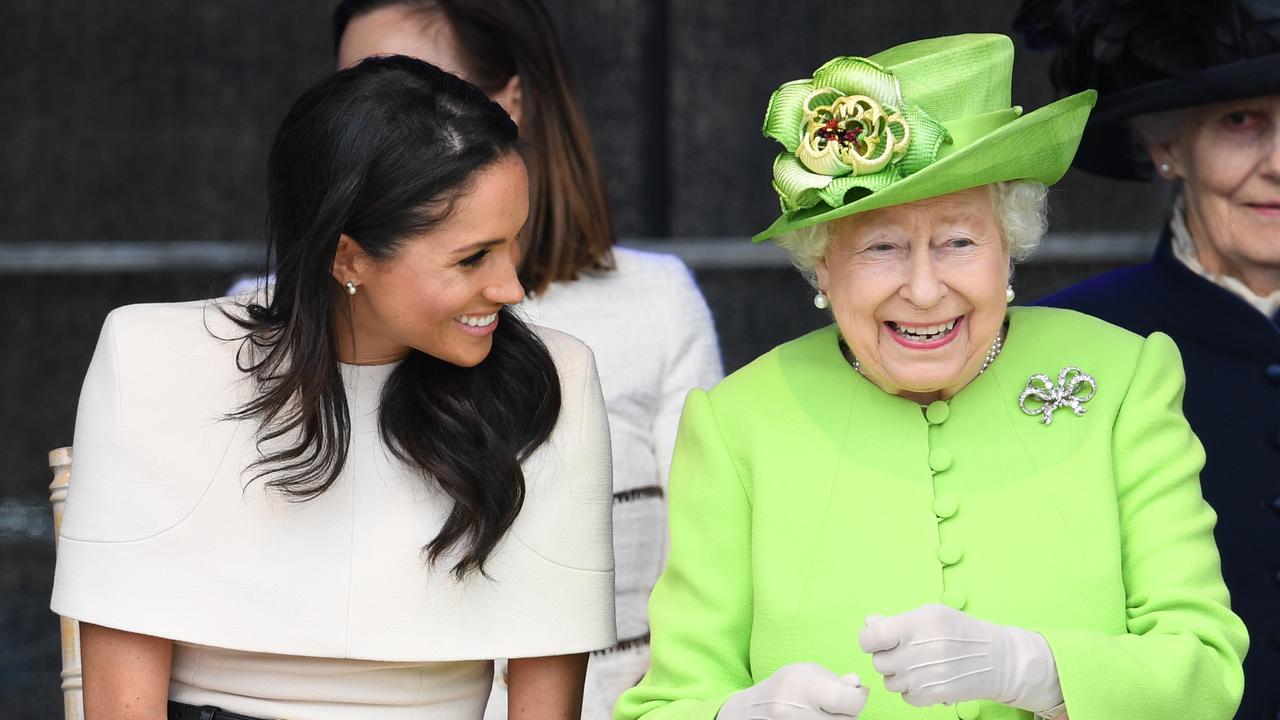 WIDNES, CHESHIRE, ENGLAND - JUNE 14:  Queen Elizabeth II laughs with Meghan, Duchess of Sussex during a ceremony to open the new Mersey Gateway Bridge on June 14, 2018 in the town of Widnes in Halton, Cheshire, England. Meghan Markle married Prince Harry last month to become The Duchess of Sussex and this is her first engagement with the Queen. During the visit the pair will open a road bridge in Widnes and visit The Storyhouse and Town Hall in Chester.  (Photo by Jeff J Mitchell/Getty Images)