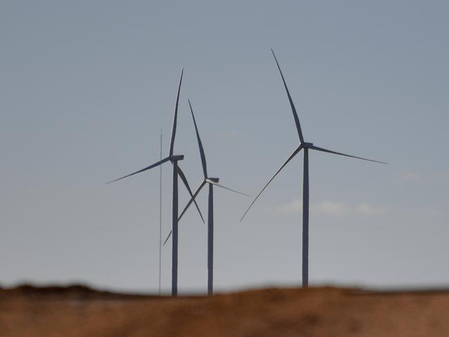 Wind turbines from the Silverton Wind Farm are seen from the west NSW town of Silverton, Saturday, July 7, 2018. (AAP Image/Mick Tsikas) NO ARCHIVING