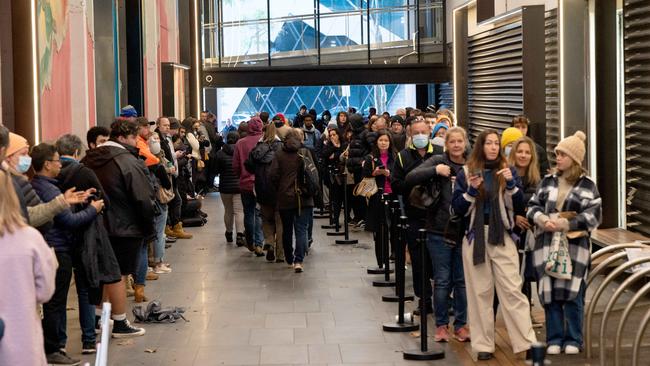 Part of the passport queue in Collins St, Melbourne. Picture: Tony Gough