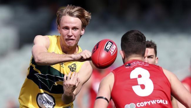 Jack Lukosius of the Eagles handballs during the SANFL prelim final. Picture: Sarah Reed