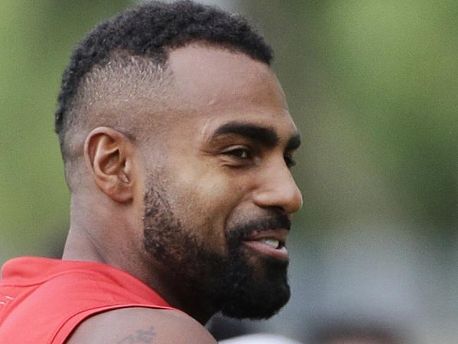 Heritier Lumumba (left) shares a joke with team mate Jimmy Toumpas during Melbourne Demons AFL training at Gosch's Paddock on Tuesday, March 3, 2015, in Richmond, Australia. Picture: Hamish Blair