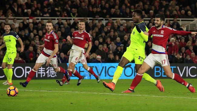 Liverpool's Belgian striker Divock Origi (2R) scores.