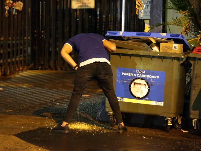 A Bulldogs player vomiting on the street during the Bulldogs Mad Monday Celebrations at the Harbour View Hotel at The Rocks. Picture: Christian Gilles