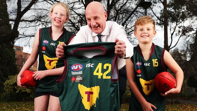 Premier Peter Gutwein with siblings Emily Apted 13 and Bailey Apted 8 of Midway Point. Inspiring passion for Tassie footy ahead of the AFL game at Blundstone Arena. Picture: Nikki Davis-Jones