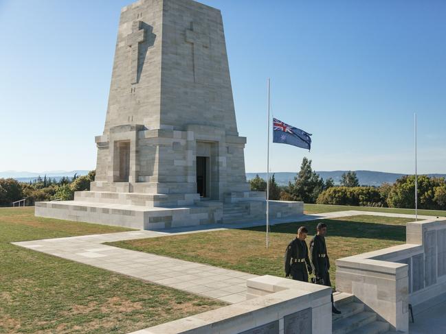 Turkish soldiers walk past the Lone Pine monument in Gallipoli. Picture: Bradley Secker