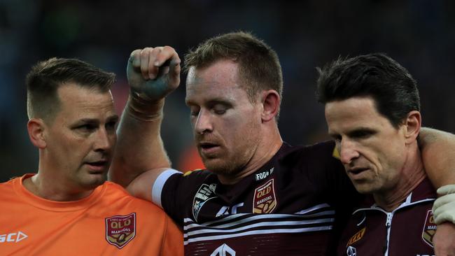 Michael Morgan leaves the field after being knocked out in Origin 3. Picture: Adam Head