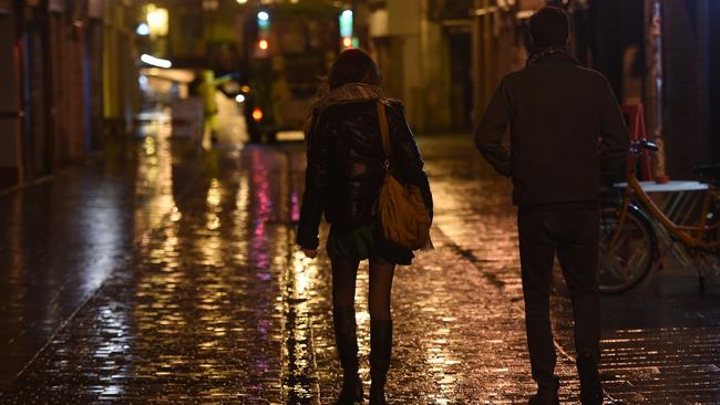 Residents of Bayonne, southwestern France, head home ahead of a nighttime curfew. Picture: AFP