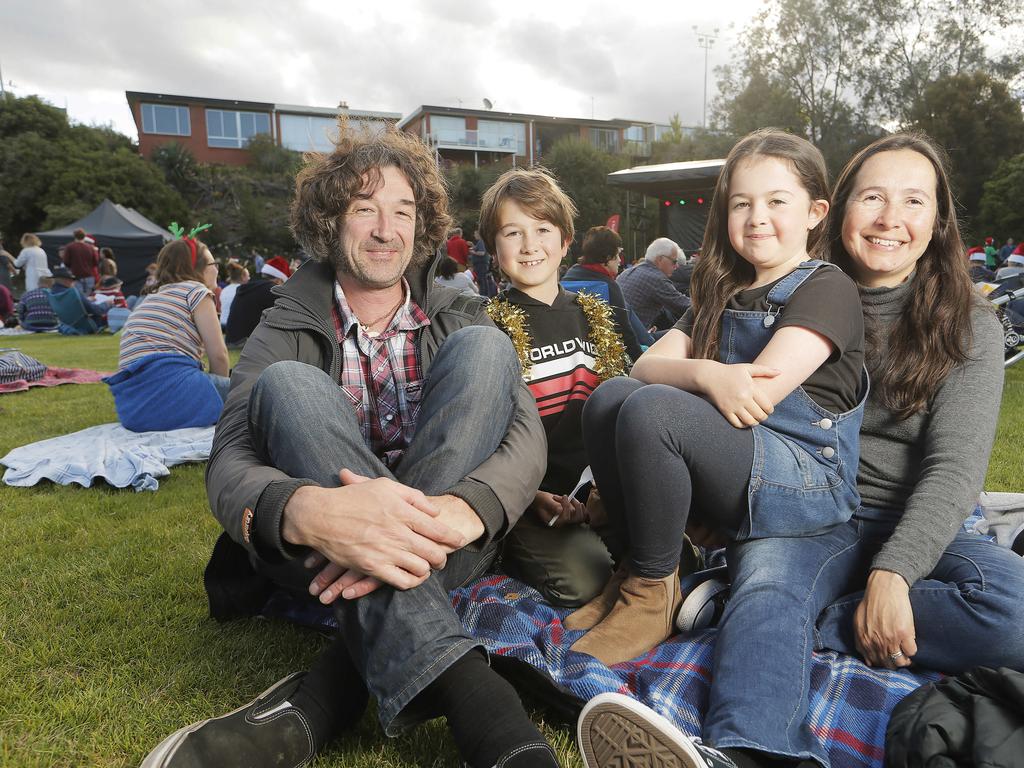 Simon, left, Huon, 10, India, 8, and Natalie of Kingston at the Carols on the Hill, Guilford Young College, West Hobart. Picture: MATHEW FARRELL