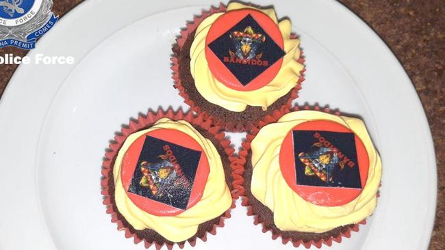 Cupcakes decorated with a skull in club colours.