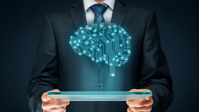 Artificial intelligence (AI), data mining, expert system software, genetic programming, machine learning, deep learning, neural networks and another modern computer technologies concepts. Brain representing artificial intelligence with printed circuit board (PCB) design. Istock