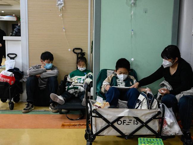 Children at a Beijing hospital wait to be seen by doctors. Picture: AFP