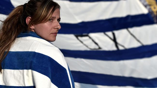 Protesters participate in a demonstration calling for a "No" vote in the forthcoming referendum on bailout conditions set by the country's creditors, in front of the Greek parliament in Athens on June 29, 2015. Greece shut its banks and the stock market and imposed capital controls after creditors at the weekend refused to extend the country's bailout past the June 30 deadline, prompting anxious citizens to empty ATM's. AFP PHOTO / ARIS MESSINIS