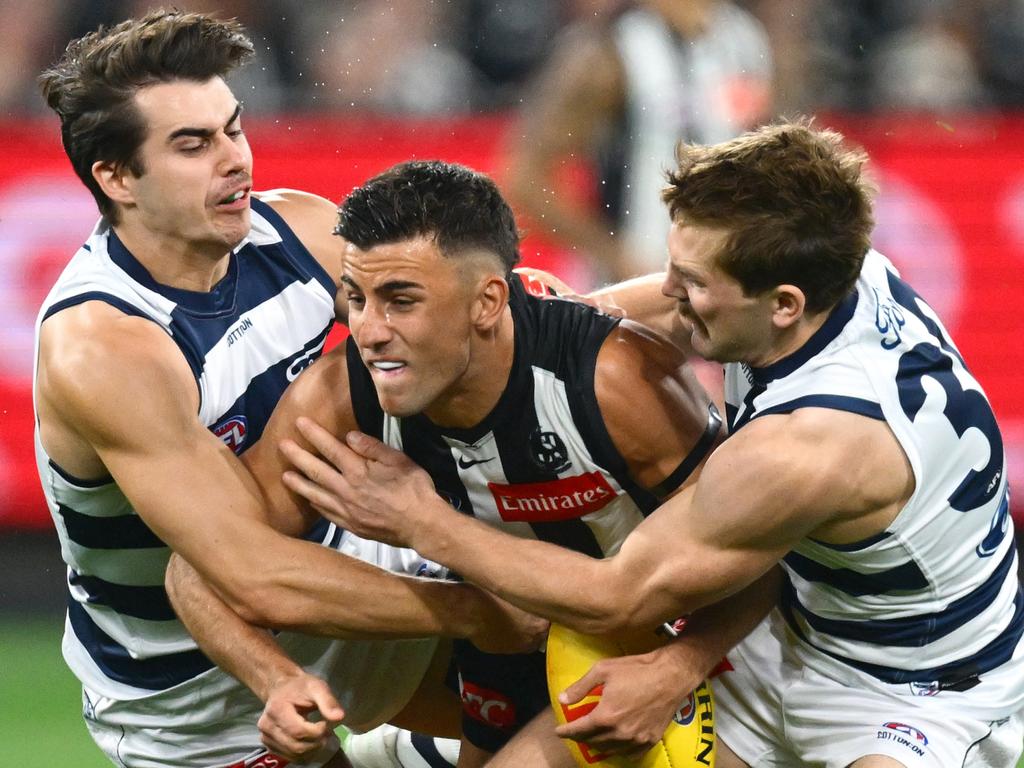 Nick Daicos is wrapped up by Oisin Mullin and Tom Atkins. Picture: Quinn Rooney/Getty Images
