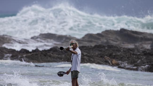 Snapper Rocks local Aboriginal identity Russell Corowa blessing the ocean on Sunday 2 January 2022. Picture: Jerad Williams