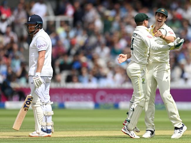 Pat Cummins and Alex Carey celebrate Jonny Bairstow’s stumping. Picture: Gareth Copley/Getty Images