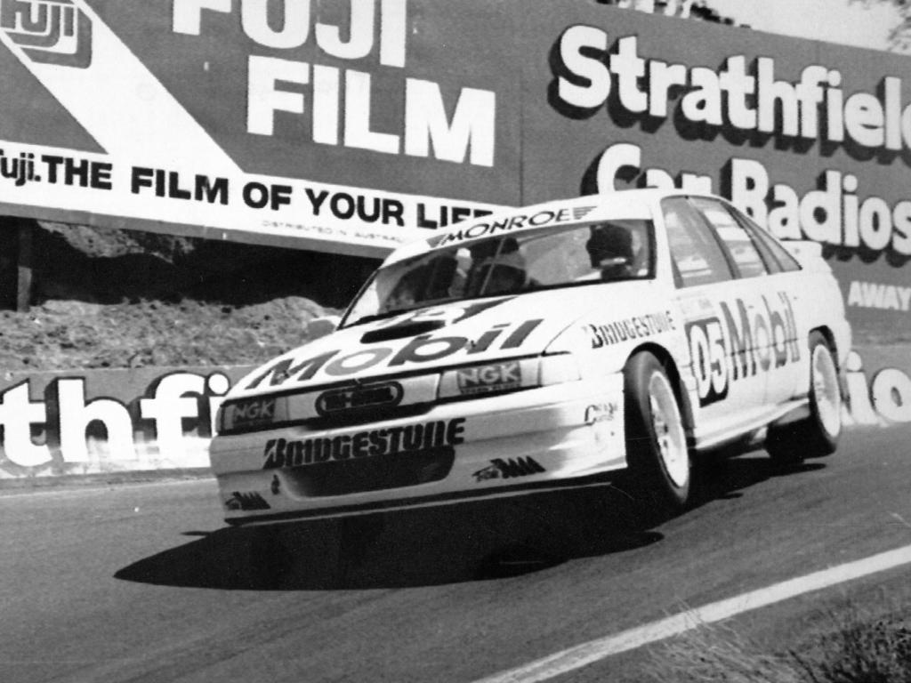 Motor car racing driver Peter Brock raises two wheels on his Holden Commodore through the dipper in his bid to win pole position at the Tooheys 1000 race at Mount Panorama Circuit, Bathurst, NSW 05 Oct 1991. Picture: News Ltd/credit Jon Reid