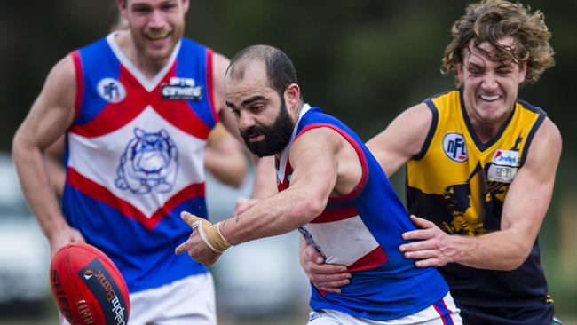 North Heidelberg’s Gazi Assi tries to gather the ball during last year’s Northern Football League Division 2 finals. Photo: Stuart Walmsley