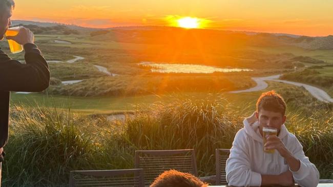 Sydney forward Tom Papley and mates enjoy the sunset at Barnbougle Dunes, Tasmania.