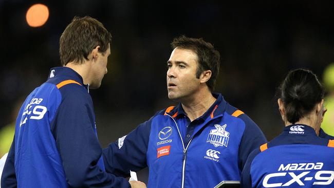 North Mellbourne coach Brad Scott has the Kangaroos defying the critics and the odds.