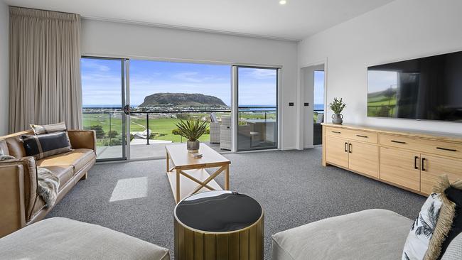 The modern and spacious living room, complete with an outdoor deck for maximising the view. Picture: Supplied