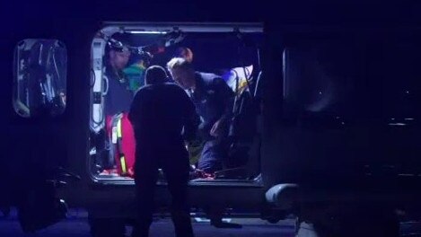 Paramedics treating a patient. Picture: ABC News