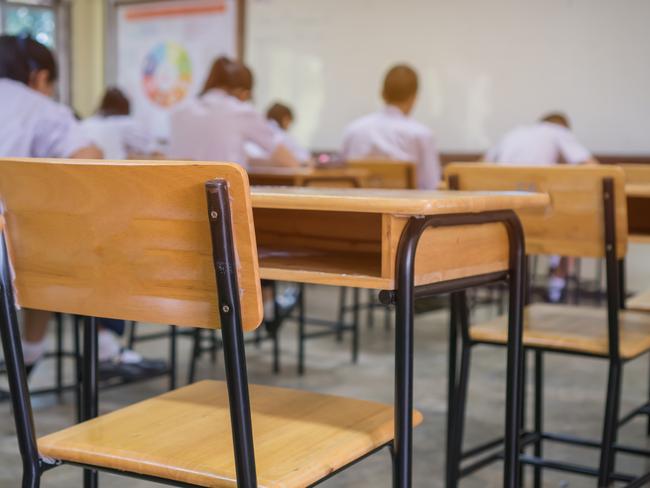 Lecture room or School empty classroom with Student taking exams, writing examination for studying lessons in high school thailand, interior of secondary education, whiteboard. educational concept