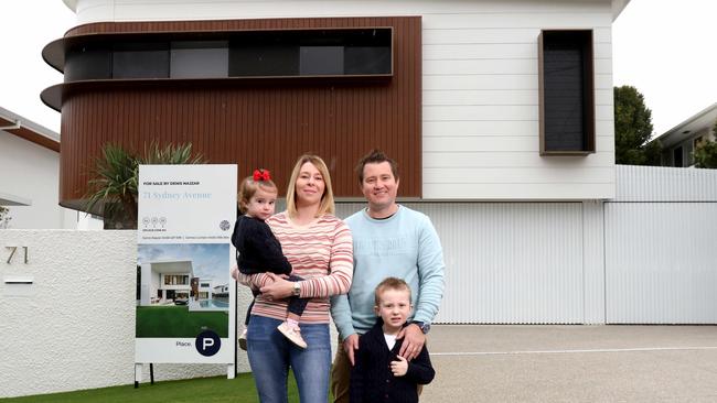 Travis Pegg, with his wife Melissa Hanbidge-Pegg and children Sebastian, 4, and Harriet, 2, are selling their house at Camp Hill and are planning to build a new home. Picture: Steve Pohlner