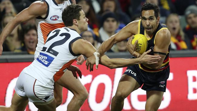 Crows’ leading goal scorer Eddie Betts under pressure from Josh Kelly before his memorable sealer against Greater Western Sydney. Picture SARAH REED