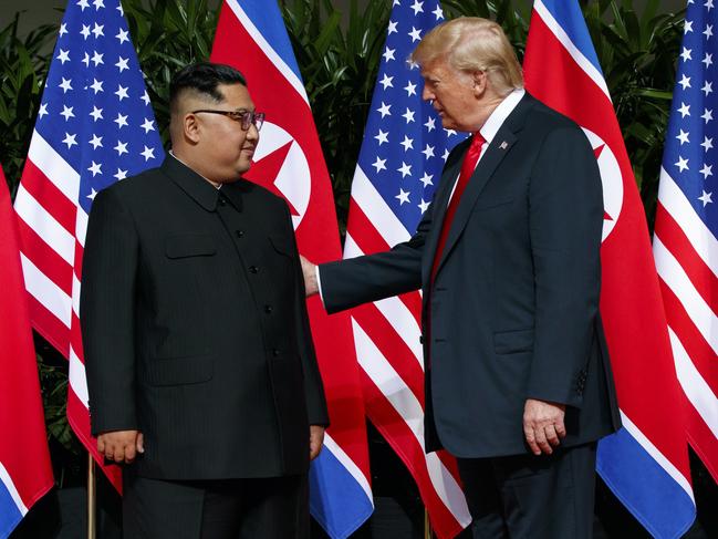 President Donald Trump meets with North Korean leader Kim Jong Un and gives him a pat on the back. Picture: AP