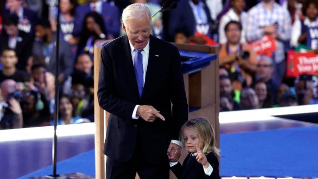 With his grandson Beau Biden after his speech. Picture: Kamil Krzaczynski/AFP