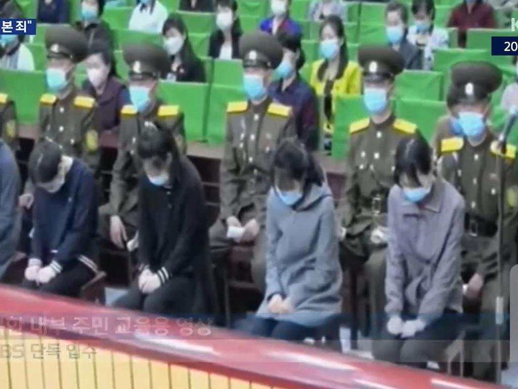 The teenage girls sat with their heads bowed. Picture: KBS