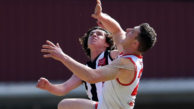 Lachlan Benson and Joshua Wallis contest an aerial battle     Picture: Andy Brownbill