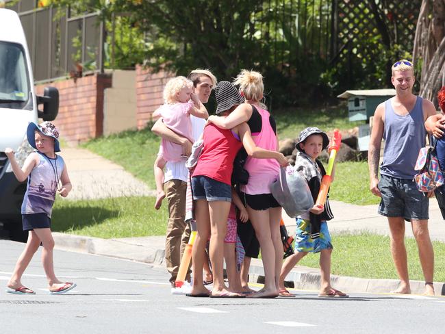 Families evacuated from the exclusion zone during the siege at Southport. Pic Ric Frearson