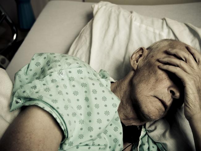 man in bed in aged care nursing home Istock 000008259074medium