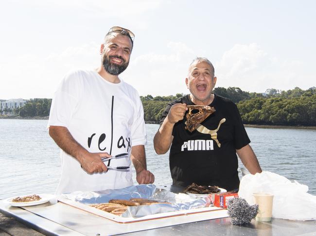 Parramatta: Mahmoud Fahmy and father Salah Fahmy cooking the family BBQ on Christmas Day overlooking the Parramatta River. Picture: Daily Telegraph / Monique Harmer