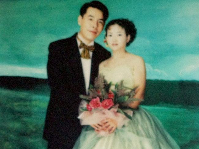 A wedding picture of Min Lin and Yun Li (Lilly) hangs on the wall inside the entrance to the Lin family home in Epping, Sydney.