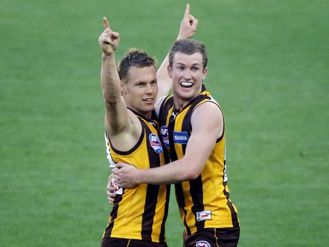 Sam Mitchell and Xavier Ellis celebrate a goal in the 2008 grand final.