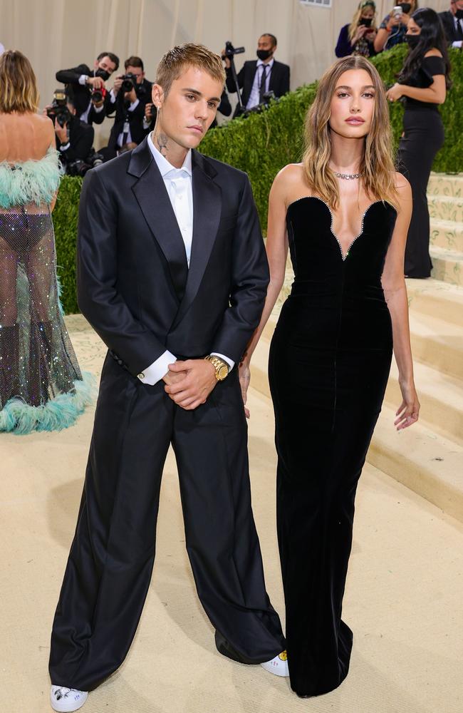 Hailey Bieber, right, with husband Justin Bieber, always nails party-appropriate beauty – including at the Met Gala. Picture: AFP