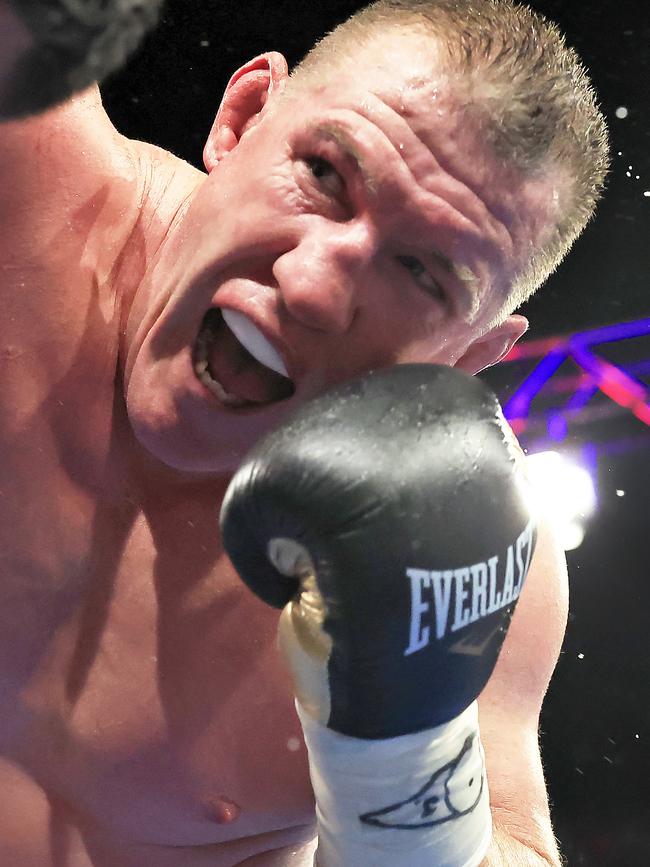 Paul Gallen punches Justin Hodges during his last fight in November 2022. Picture: Mark Evans/Getty Images